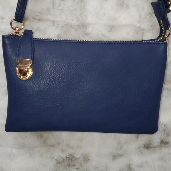 Navy blue crossbody purse with lock. - Picture 1 of 11